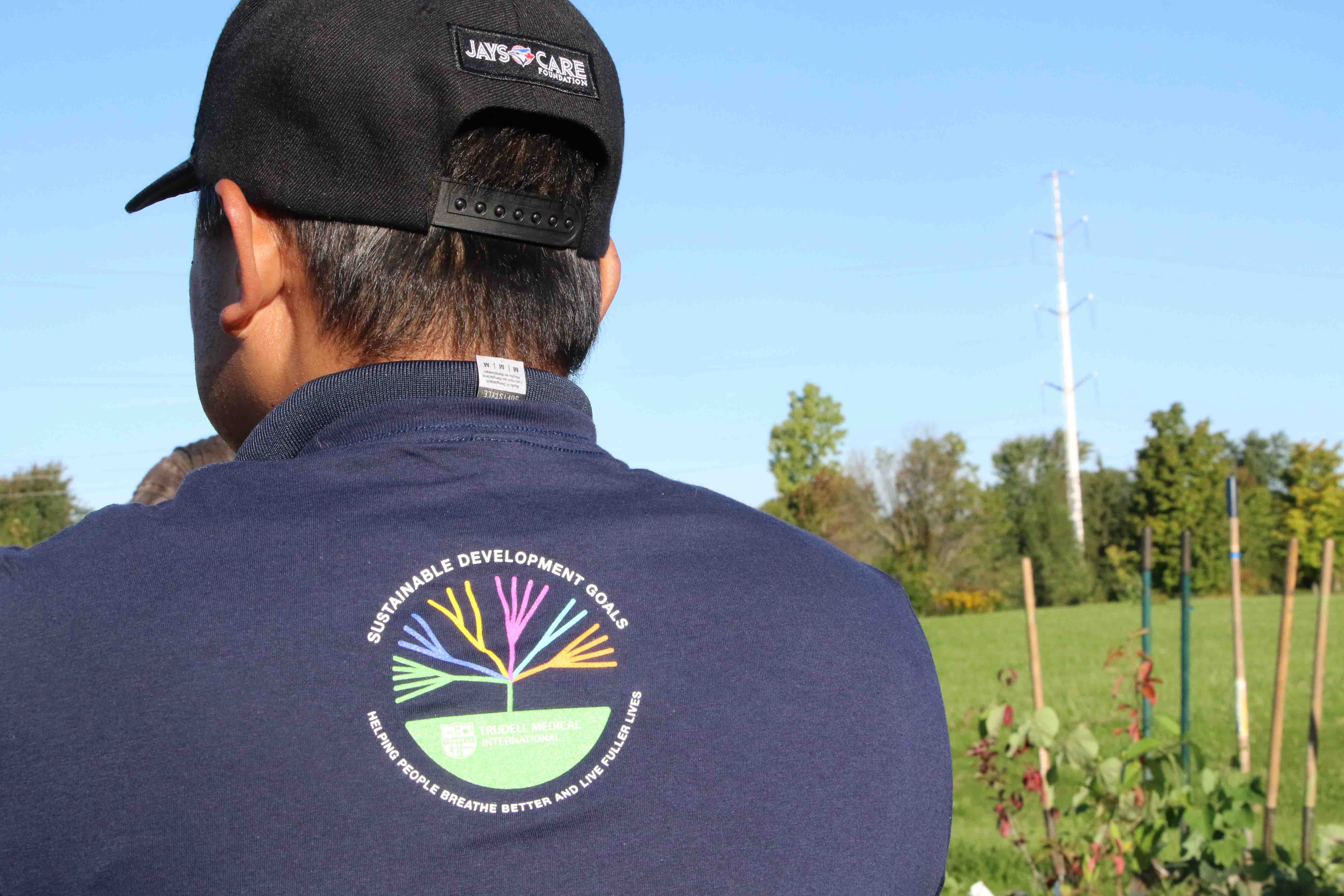 Back of person's t-shirt from tree planting event